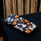 Pumpkin Parade Matte Glass MagSafe iPhone Case – lifestyle view 2